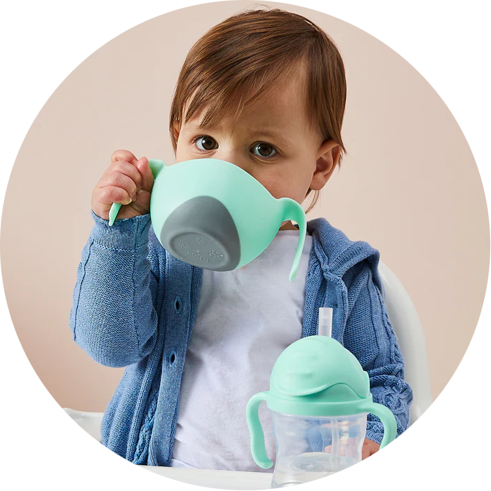 kid drinking from sippy cup